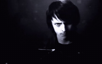 A Man Stands In Front Of A Wall Of Numbers GIF