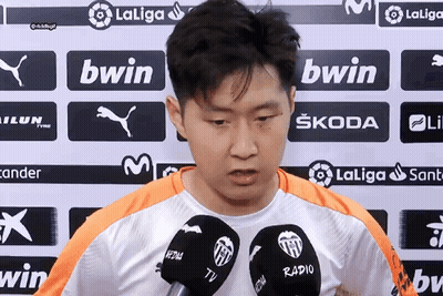 A Man Stands In Front Of A Wall With Bwin Logos On It GIF