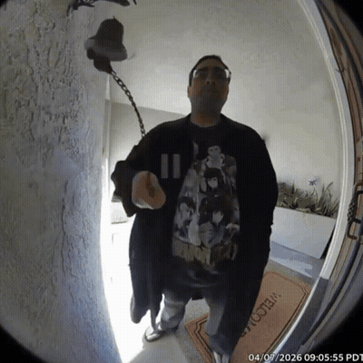 A Man Stands In Front Of A Welcome Mat GIF