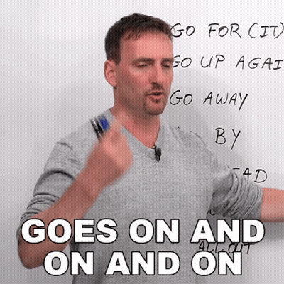 A Man Stands In Front Of A White Board And Says " Goes On And On " GIF