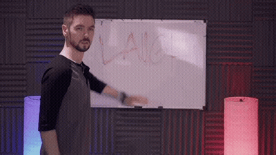 A Man Stands In Front Of A White Board With The Word Laugh Written On It GIF