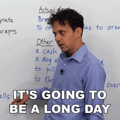 A Man Stands In Front Of A White Board With The Words " It 'S Going To Be A Long Day " GIF