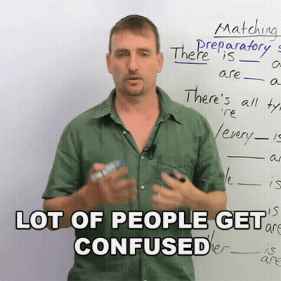 A Man Stands In Front Of A White Board With The Words " Lot Of People Get Confused " GIF