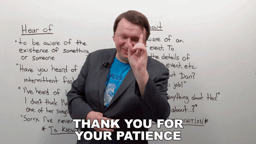 A Man Stands In Front Of A White Board With The Words Thank You For Your Patience Written On It GIF