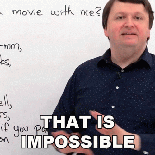 A Man Stands In Front Of A White Board With The Words That Is Impossible Written On It GIF