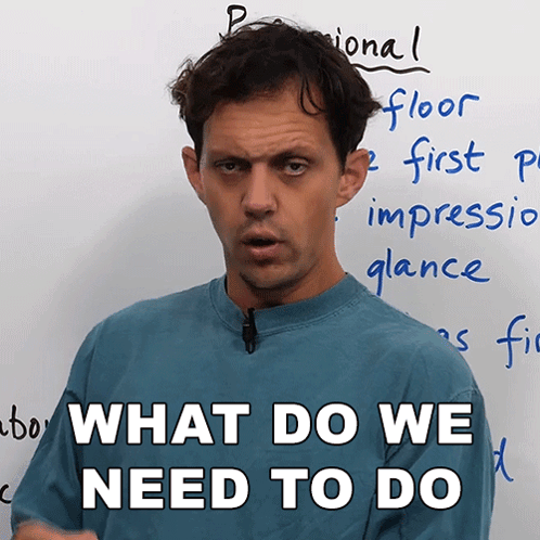 A Man Stands In Front Of A White Board With The Words " What Do We Need To Do " GIF