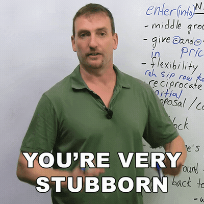 A Man Stands In Front Of A White Board With The Words You 'Re Very Stubborn GIF