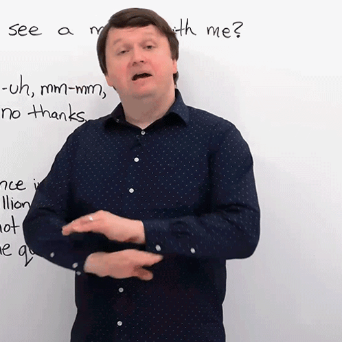 A Man Stands In Front Of A Whiteboard With The Words See A Month With Me Written On It GIF