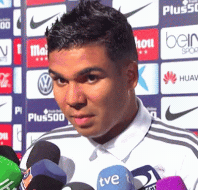 A Man Stands In Front Of Several Microphones Including A Tve One GIF