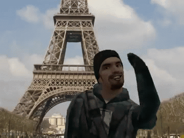 A Man Stands In Front Of The Eiffel Tower Waving GIF