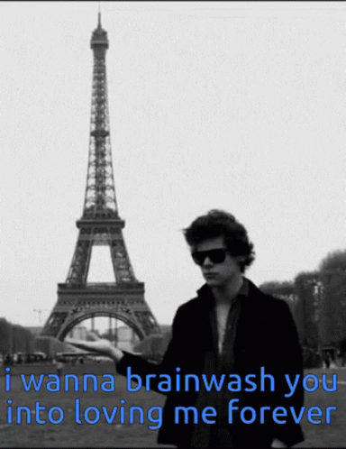 A Man Stands In Front Of The Eiffel Tower With A Caption That Says I Wanna Brainwash You Into Loving Me Forever GIF