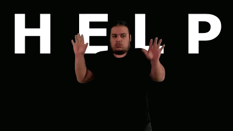 A Man Stands In Front Of The Word Help In White Letters GIF