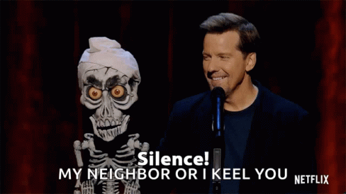 A Man Stands Next To A Skeleton Puppet And Says Silence My Neighbor Or I Keel You Netflix . GIF