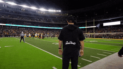A Man Stands On A Football Field Wearing A Shirt That Says San Francisco On The Back GIF