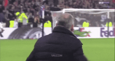 A Man Stands On A Soccer Field With The Word Valcom On The Bottom Right GIF