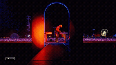 A Man Stands On A Stage In Front Of A Crowd With A Sign That Says Cancelled GIF