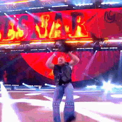 A Man Stands On A Stage In Front Of A Sign That Says ' Us Var ' GIF