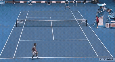 A Man Stands On A Tennis Court With Kia Advertisements On The Walls GIF