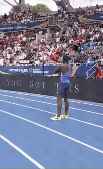 A Man Stands On A Track In Front Of A Sign That Says ' You Got This ' GIF