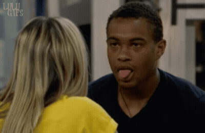 A Man Sticking His Tongue Out While Looking At A Woman With The Words Lulu Gifs On The Bottom Right GIF