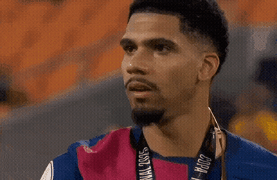 A Man Sticking His Tongue Out While Wearing A Shirt With A Lion On It GIF