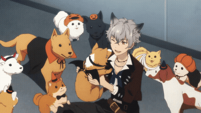 A Man Surrounded By Dogs And Cats With One Wearing A Pumpkin Headband GIF