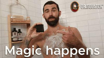 A Man Taking A Bath With The Words " Magic Happens " Written On The Bottom GIF