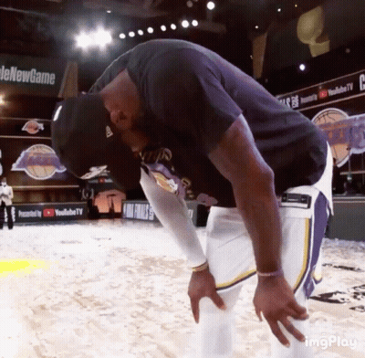 A Man Taking A Break On A Basketball Court With A Youtube Tv Banner In The Background GIF