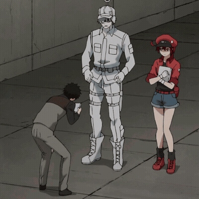 A Man Taking A Picture Of A Man In A White Uniform And A Woman In A Red Uniform GIF