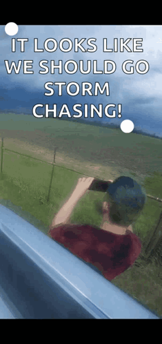 A Man Taking A Picture Of A Storm With A Caption That Says " It Looks Like We Should Go Storm Chasing ! " GIF