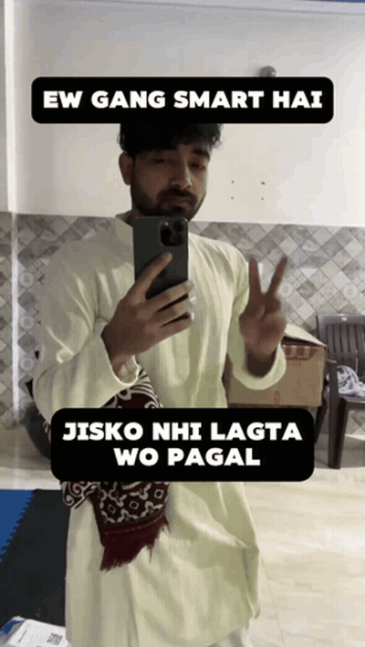 A Man Taking A Picture Of Himself With A Caption That Says " Ew Gang Smart Hai Jisko Nhi Lagta Wo Pagal " GIF