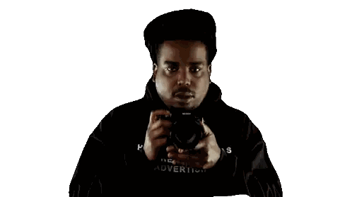 A Man Taking A Picture With A Camera With A White Background Sticker