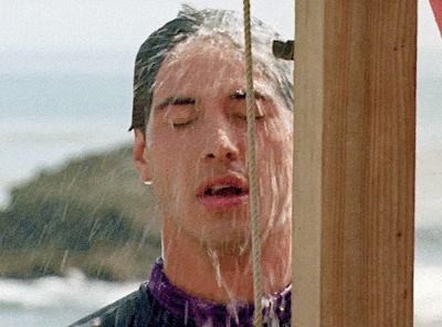A Man Taking A Shower With His Eyes Closed And Water Coming Out Of His Mouth GIF