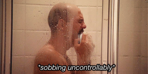 A Man Taking A Shower With The Words " Sobbing Uncontrollably " On The Bottom GIF