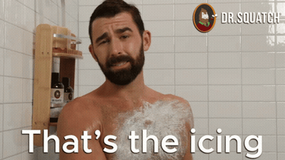 A Man Taking A Shower With The Words That 'S The Icing Behind Him GIF