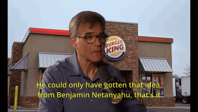 A Man Talking In Front Of A Burger King GIF