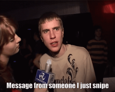 A Man Talking Into A Microphone That Says " Message From Someone I Just Snipe " On It GIF