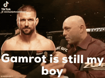 A Man Talking Into A Microphone With The Words Gamrot Is Still My Boy Below Him GIF