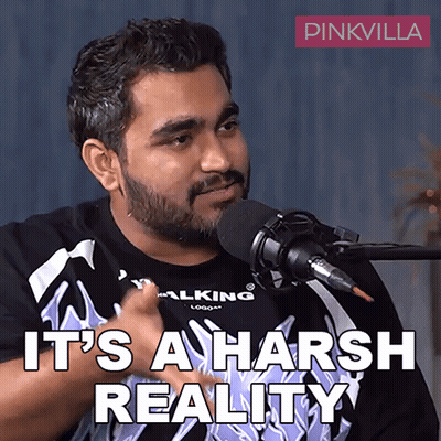 A Man Talking Into A Microphone With The Words " It 'S A Harsh Reality " Written Below Him GIF