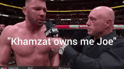 A Man Talking Into A Microphone With The Words " Khamzat Owns Me Joe " GIF