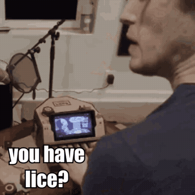 A Man Talking Into A Microphone With The Words " You Have Lice " On The Screen GIF