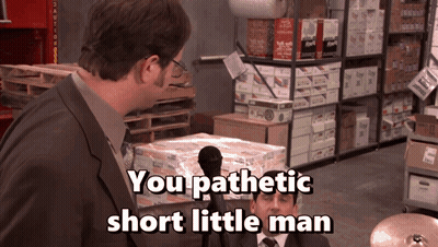a man talking into a microphone with the words you pathetic short little man
