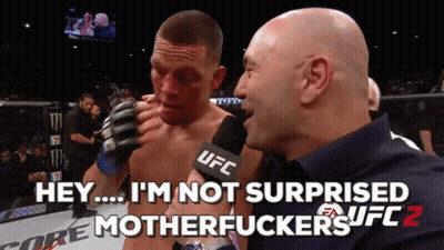 A Man Talking Into A Ufc Microphone While Another Man Watches GIF