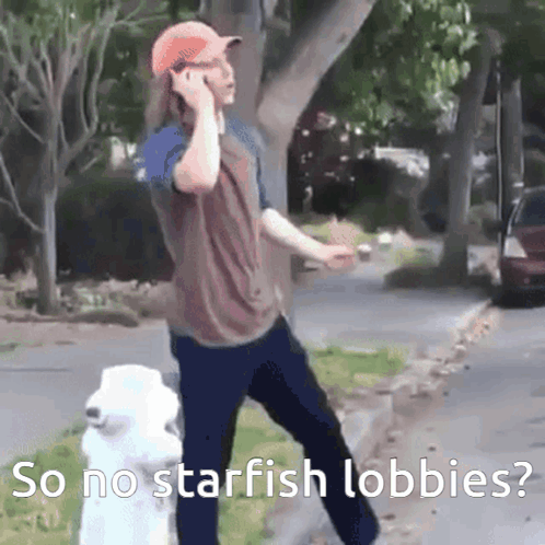 A Man Talking On A Cell Phone Next To A Fire Hydrant With The Words So No Starfish Lobbies Below Him GIF