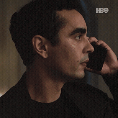 A Man Talking On A Cell Phone With The Words " Do N't Do Anything " GIF