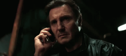 A Man Talking On A Cell Phone With The Words " Good Luck " Below Him GIF