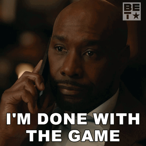 A Man Talking On A Cell Phone With The Words " I 'M Done With The Game " Below Him GIF