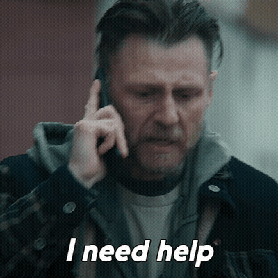 A Man Talking On A Cell Phone With The Words I Need Help Above Him GIF