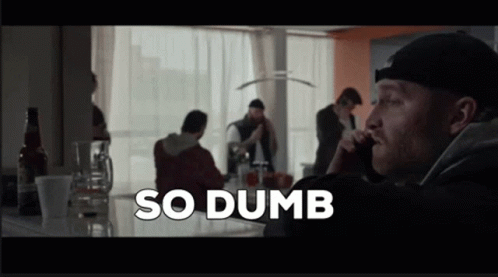 A Man Talking On A Cell Phone With The Words So Dumb Written Above Him GIF