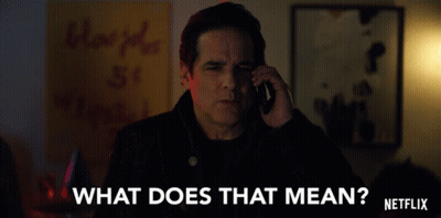 A Man Talking On A Cell Phone With The Words " What Does That Mean " Written On The Bottom GIF